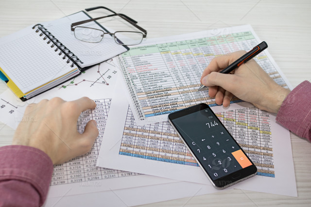 stock-photo-business-finance-table-calculator-count-smartphone-report-statistics-tax-3e770287-c1e9-4874-8308-233851250035